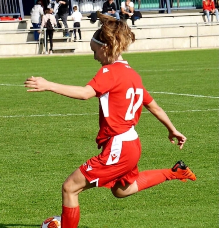 Woman plays soccer