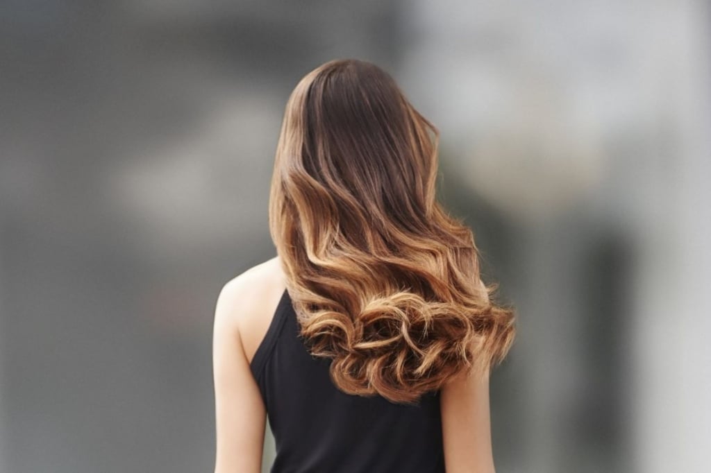 Woman with curls from behind